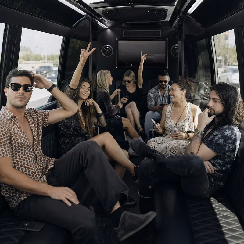 Group boarding a white charter bus for Concert Transportation transportation in Rochester