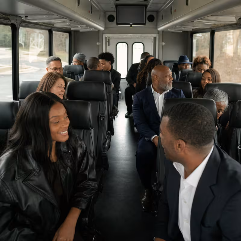 Group boarding a white charter bus for Private Event Transportation transportation in Rochester