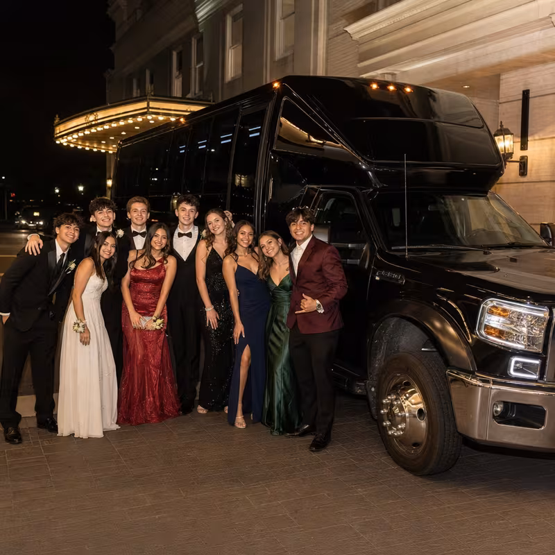 Party bus interior with wraparound leather seating and LED lighting in Rochester