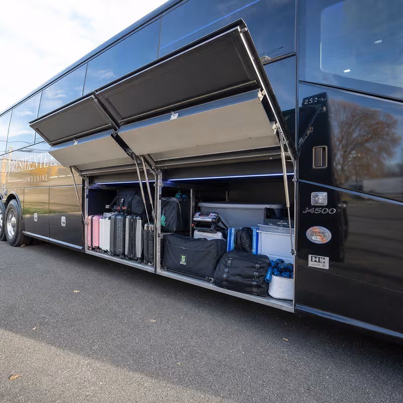 Party bus interior with wraparound leather seating and LED lighting in Rochester